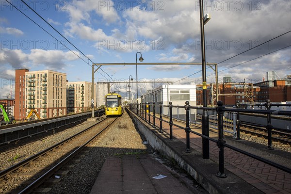 A beautiful day as a yellow train. Manchester