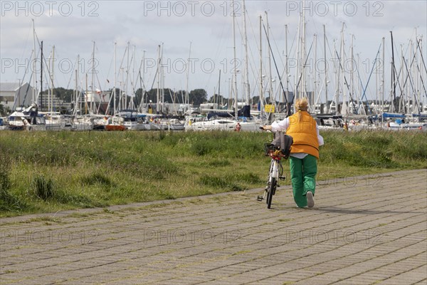 Cyclist at the marina of Cuxhaven