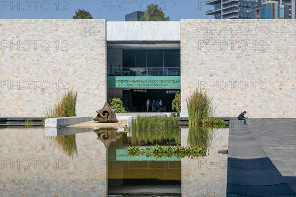 Entrance of Tenochtitlan gallery reflected in water