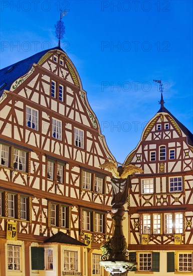 Gabled half-timbered houses on the medieval market square in the evening