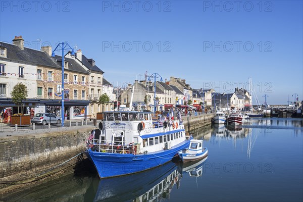 Seafood restaurant boat docked in the harbour of Port-en-Bessin-Huppain along the English Channel