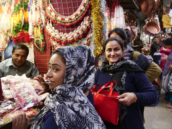 Smiling woman shopping for decorations and vendors