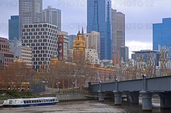 Sculptures on the Sandridge Bridge over the Yarra River and Flinders Street railway station in the city Melbourne
