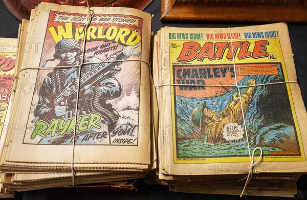 Box of Warlord and Battle comics on display in auction room