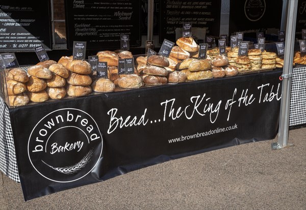 Fresh loaves of artisan bread on sale at street market stall