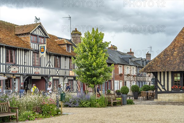 Half-timbered houses and cafes in one of the most beautiful villages in France Beuvron-en-Auge