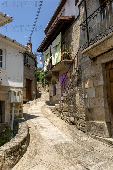Narrow street historic houses in village of Pazos de Arenteiro