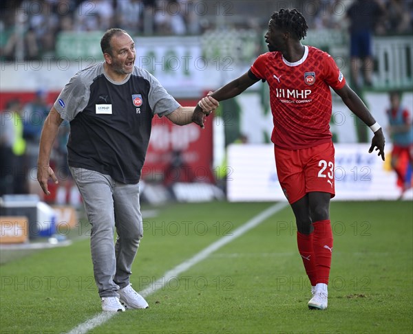 Coach Frank Schmidt 1. FC Heidenheim 1846 FCH on the sidelines talking discussion with Omar Traore 1. FC Heidenheim 1846 FCH