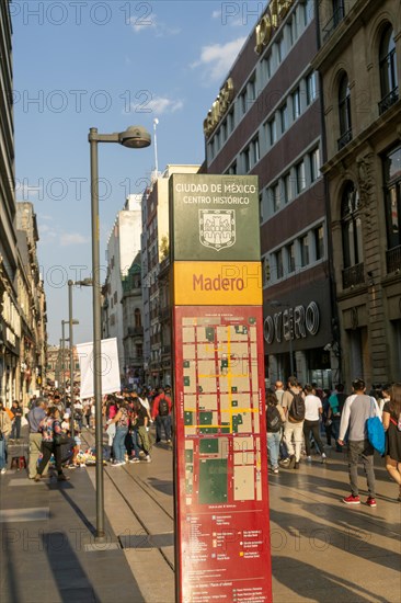 Crowd of people on pedestrianised street Avenida Madero