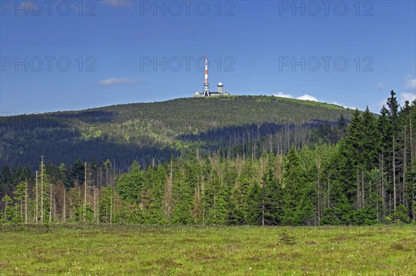 Old transmission tower and new television tower