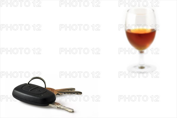 Car key and glass with alcohol