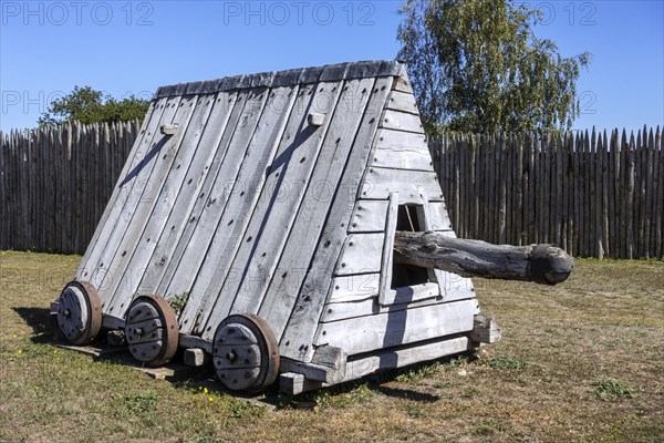 Wooden battering ram mounted on wheels