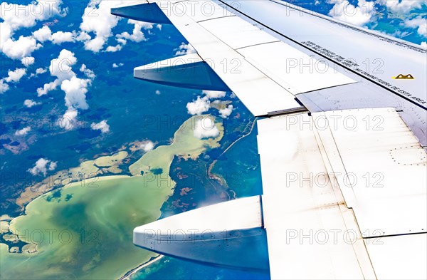 Oblique angle aerial view through plane window over Laguna Chunyaxche