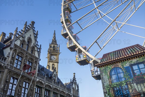 Old Post Office and Ferris wheel at Christmas market in winter in Ghent