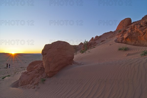 Landcruiser in the last evening light in front of the Flaming Cliffs