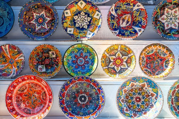 Souvenir shop with the sale of colorful plates in the city of Gjirokaster or Gjirokastra. Albanian