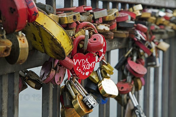 Padlocks on Bridge of Love where married couples hang their padlock and throw away the key in the Angara river in Irkutsk