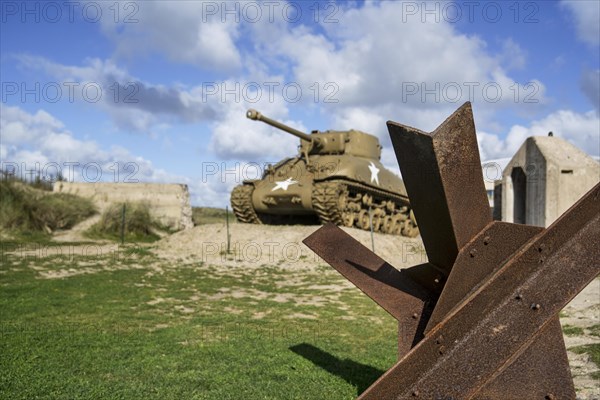Czech hedgehog and M4 Sherman tank in front of the Musee du Debarquement Utah Beach