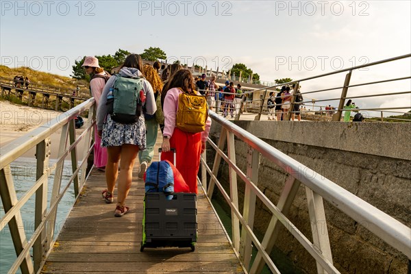 Passengers arriving at ferry terminal pier