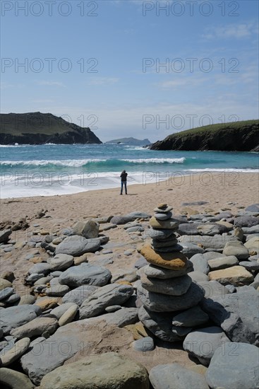 Beautiful weather at a beach on the Dingle peninsula with a view of the island of Inishtooskert