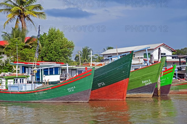 Traditional colourful wooden fishing boats in the harbour of New Amsterdam