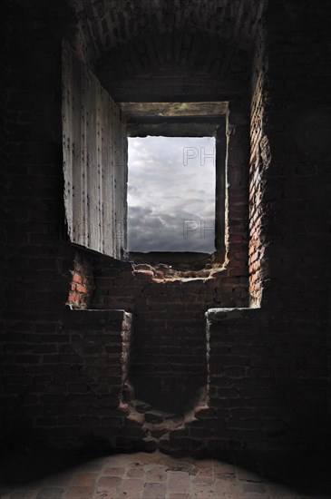 Room with window seat in recess inside medieval Beersel Castle