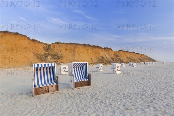 Roofed wicker beach chairs at the Rotes Kliff