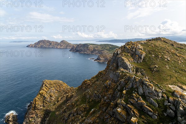 West facing steep cliffs view north from Isla del Faro