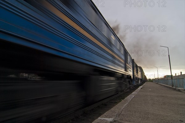 Diesel locomotive pulling goods train on the Trans-Mongolian railway line out of Ulanbator towards the south