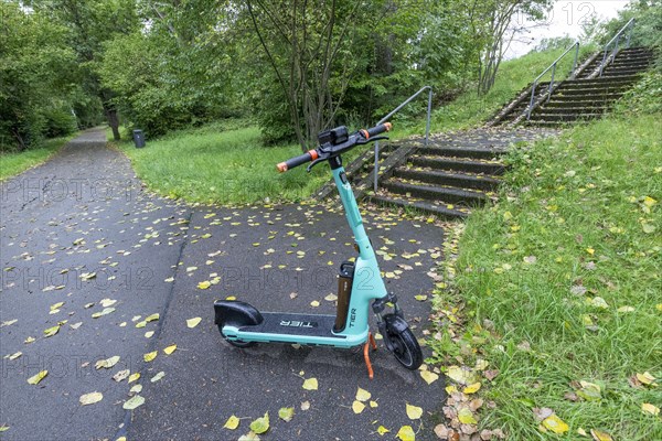 E-scooter of bike rental company TIER parked on pavement