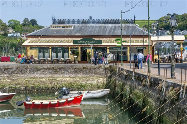 Boats moored in inner harbour view to Embankment cafe bistro