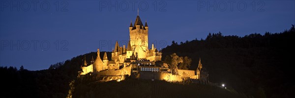 Illuminated Reichsburg Cochem in the evening