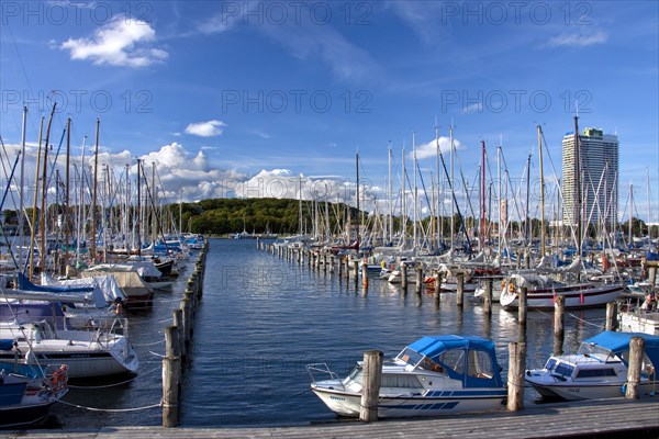 Sailing boats in the Travemuende harbour and the Maritim Hotel