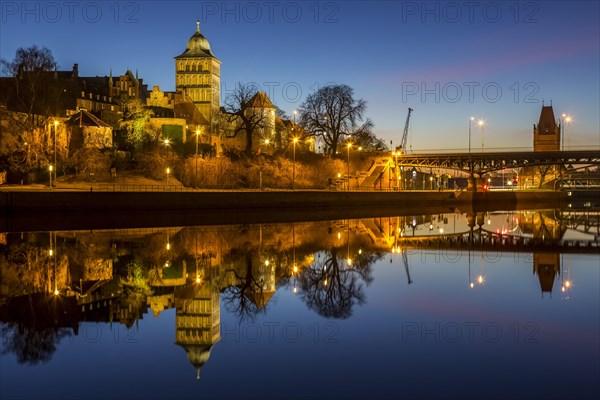Gothic Burgtor Gate reflected in water of the Elbe Luebeck Canal