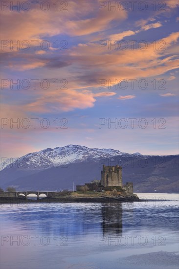 Eilean Donan Castle in Loch Duich in winter at sunset