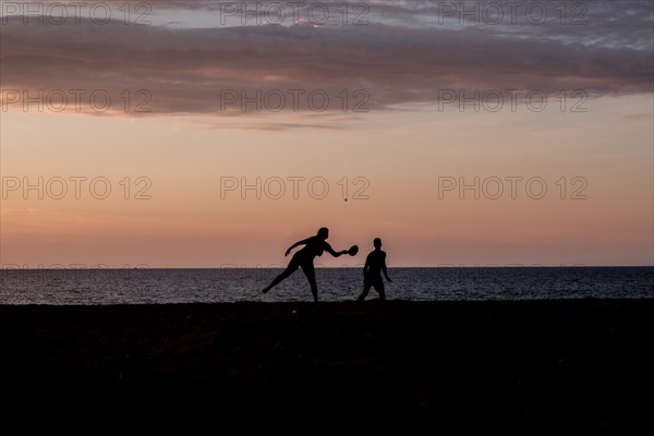 Ball players on the beach of the Mediterranean island of Corsica