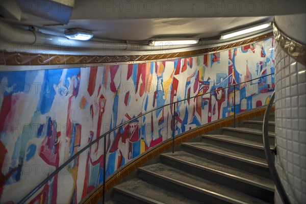 Staircase in the Metro station Abbesses decorated with an abstract painting