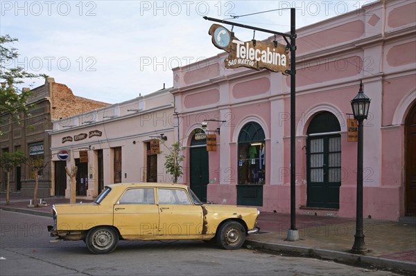 Yellow dilapidated car in Cafayate