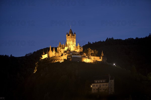 Illuminated Reichsburg Cochem in the evening