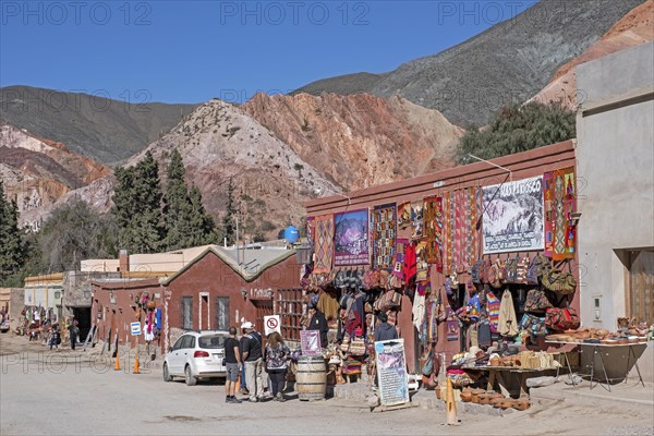 Street with souvenir shops in the village Purmamarca at the foot of Cerro de los Siete Colores