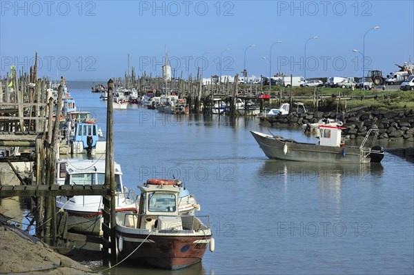 Fishing boats and oyster farming boats in the harbour Port du Bec near Beauvoir-sur-mer