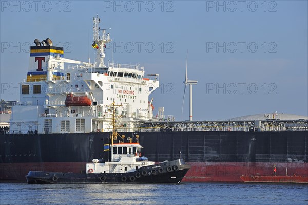 Tugboat and tanker in the Ghent harbour