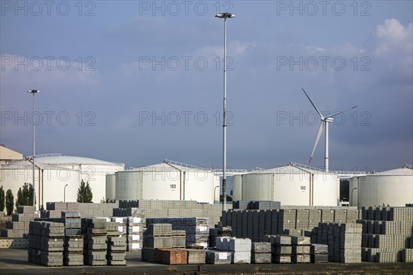 Concrete paving bricks by MARLUX KLAPS STRADUS and storage tanks of Oiltanking Ghent