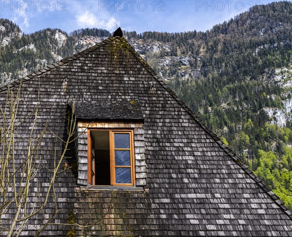 Windows in the attic of a Bavarian wooden house