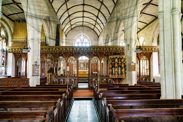 View from nave to rood screen inside village parish church of Saint Andrew