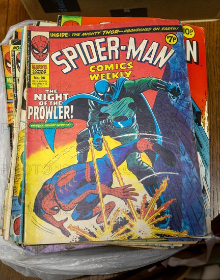 Box of Spider-Man comics on display in auction room