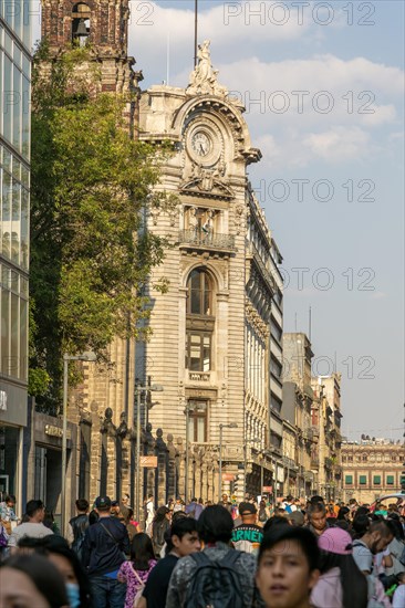 Crowd of people on pedestrianised street Avenida Madero