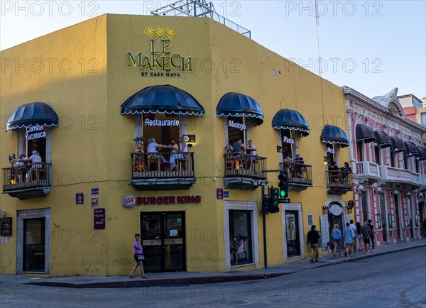 Le Makech restaurant people sitting on balconies in evening