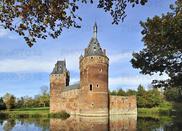 The medieval Beersel Castle surrounded by a moat
