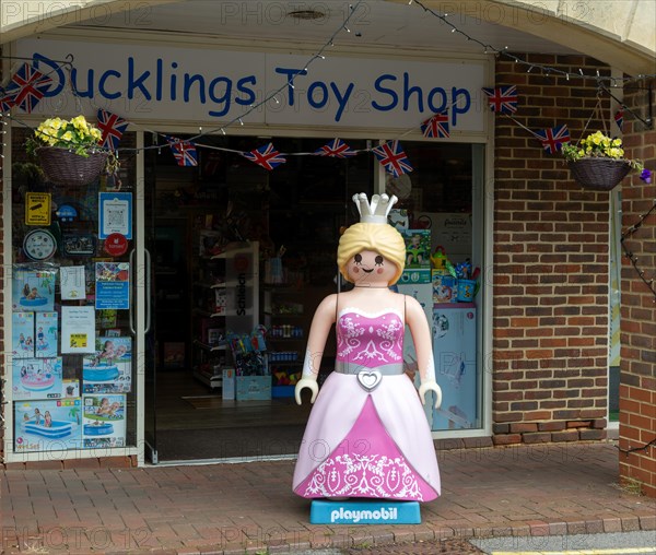 Giant Playmobil princess or queen model outside toy shop